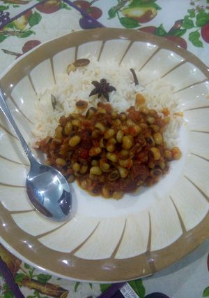 A picture of White rice with bean stew.