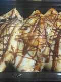 Banana crepe with chocolate syrup