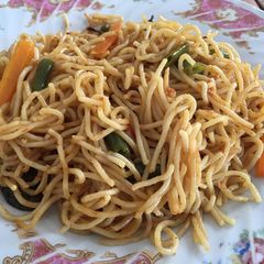 A picture of Spaghetti with vegetables.