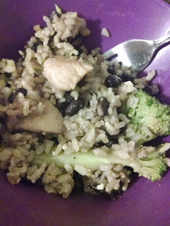 A picture of Chicken with broccoli, black beans and rice.