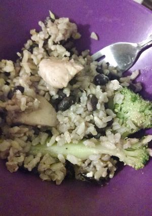 A picture of Chicken with broccoli, black beans and rice.