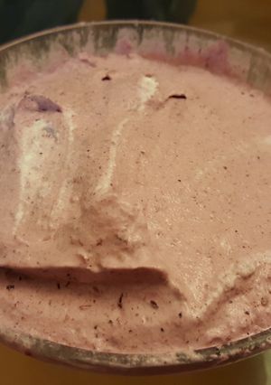 A picture of orange and berry whipped creams.