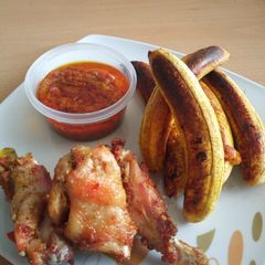 A picture of Oven grilled plantain and drumsticks with Ally sweet pepper sauc.