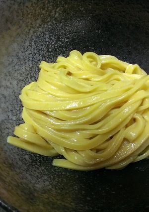 A picture of Bright Yellow Turmeric Udon Noodles.