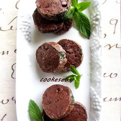 A picture of Chocolate Cookies with Lots of Fresh Mint.