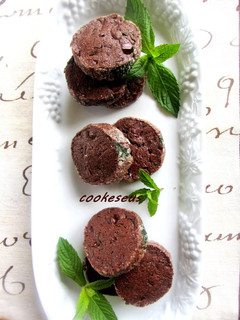 A picture of Chocolate Cookies with Lots of Fresh Mint.
