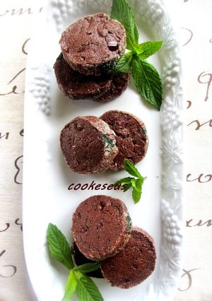A picture of Chocolate Cookies with Lots of Fresh Mint.