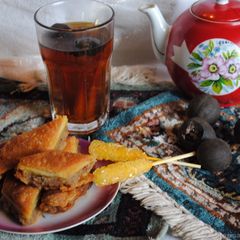 A picture of Persian style black tea with dried lime.