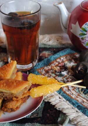 A picture of Persian style black tea with dried lime.