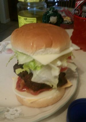 A picture of Grilled bacon dorito cheese burgers.
