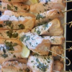 A picture of SALMON pops with dill capers crema.