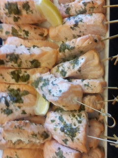 A picture of SALMON pops with dill capers crema.