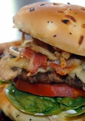 A picture of Seasoned Big Boy Turkey Burger with Feta and Frenchs French Fried Onions.