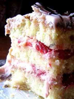 A picture of Vanilla Cake W/ Strawberry Cream Frosting.