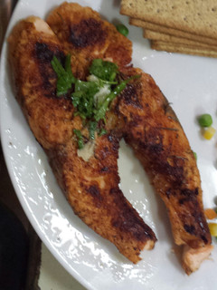 A picture of Grilled Salmon with parsley dressing.