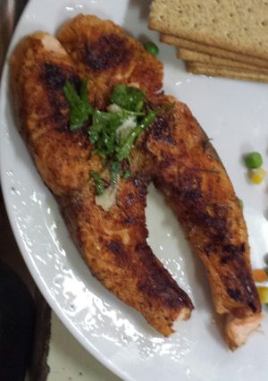 A picture of Grilled Salmon with parsley dressing.