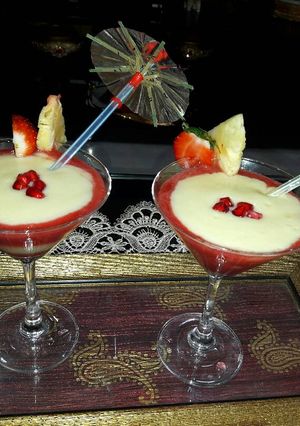 A picture of Pinacolada and strawberries mocktail.