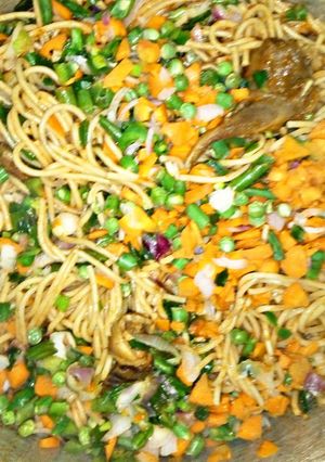 A picture of Spaghetti with veggies.