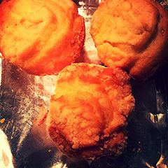 A picture of Lemony Cream Cheese Muffins with Streusel Topping.