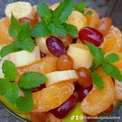 A picture of Tropical fruit bouquet 🌿🌿🍓🍉.