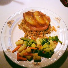 A picture of Pork Chops with Apple and Stuffing.