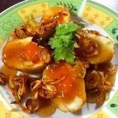 A picture of Thai Sweet And Sour Fried Boiled Eggs (Khai Luk Koei).