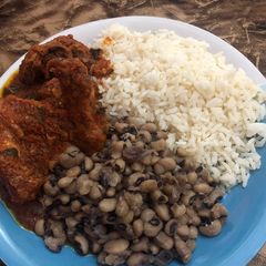 Beans,rice,goat and chicken stew A picture of Beans,rice,goat and chicken stew.