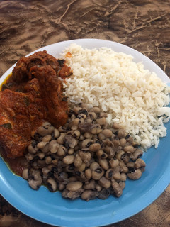 A picture of Beans,rice,goat and chicken stew.