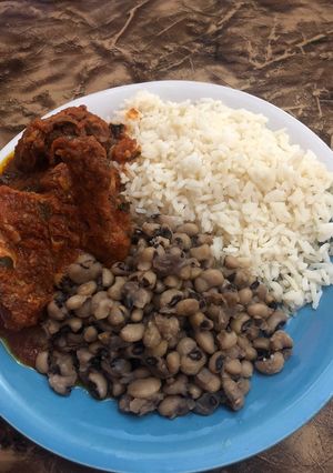 A picture of Beans,rice,goat and chicken stew.