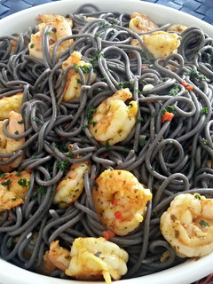 A picture of Simple, Black pasta with shrimp.