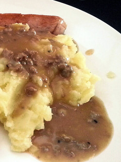 A picture of Mashed Potato with Gravy Sauce (in english & bahasa).
