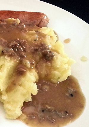 A picture of Mashed Potato with Gravy Sauce (in english & bahasa).