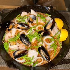 A picture of Perfect Paella with seafood and crispy bottom 🤣❤️❤️.