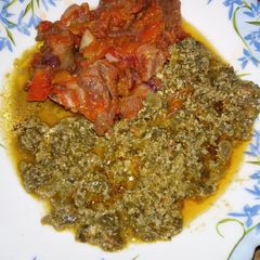 A picture of Fried goat meat with Kienyeji.