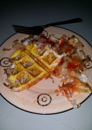 A picture of Hash brown and egg waffle.