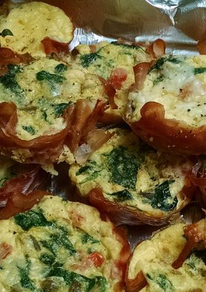 A picture of Mini Quiche in Prosciutto cups.
