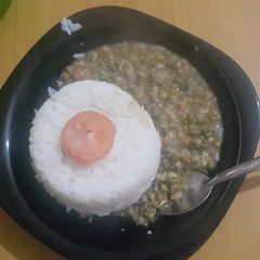 A picture of Green grams served with boiled rice.