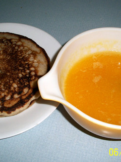 A picture of Orange sauce for pancakes and waffles.