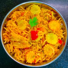 A picture of Baby Corn & Tomato Masala Bath Rice Spiced With Pav Bhaji Masala.