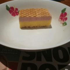 A picture of Vanilla, mango & raspberry ice cream slice.