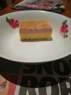 A picture of Vanilla, mango & raspberry ice cream slice.