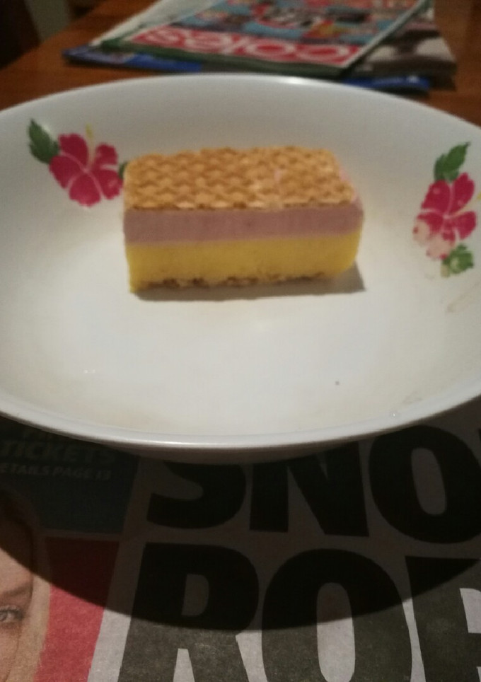 A picture of Vanilla, mango & raspberry ice cream slice.