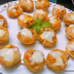 A picture of Cheese Corn Pani Puri Shots.