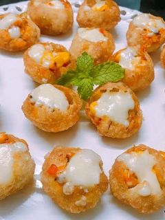 A picture of Cheese Corn Pani Puri Shots.
