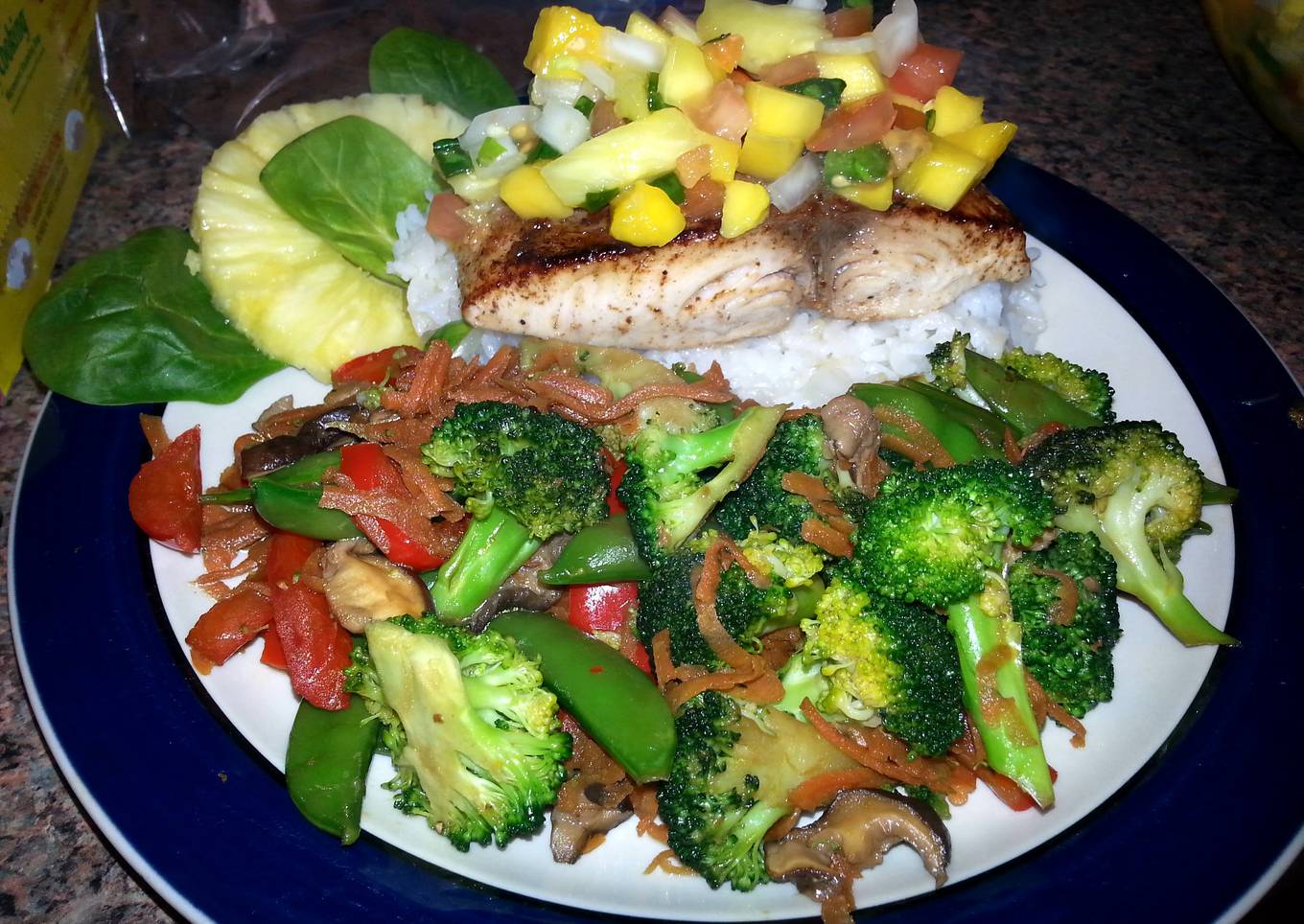 Pan Seared Halibut with Pineapple/Mango Salsa and Stir Fried Portobello and Vegetable Medley.