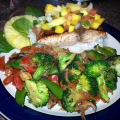 A picture of Pan Seared Halibut with Pineapple/Mango Salsa and Stir Fried Portobello and Vegetable Medley..