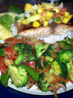 A picture of Pan Seared Halibut with Pineapple/Mango Salsa and Stir Fried Portobello and Vegetable Medley..