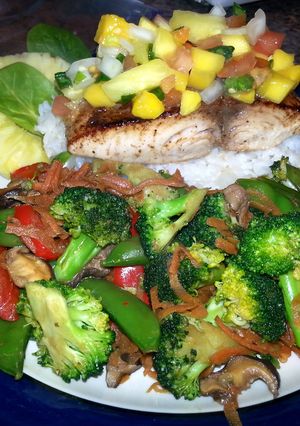 A picture of Pan Seared Halibut with Pineapple/Mango Salsa and Stir Fried Portobello and Vegetable Medley..