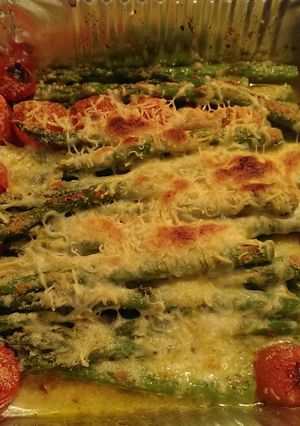 A picture of Asparagus with grape tomatoes.