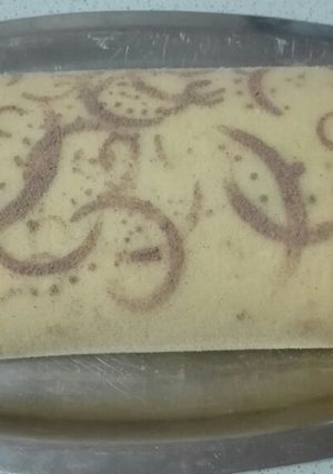 Una foto de Arrollado de frutillas, crema y dulce de leche